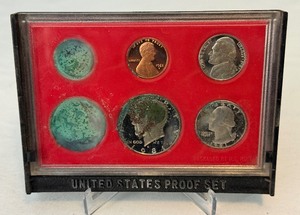 lot 108 image: 1981 Proof Set (6 coins) - No external case, significant fire damage evident