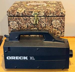 lot 97 image: ORECK XL Canister Vacuum with Hose & Attachments in Patterned Carry Case