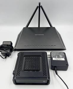 lot 99 image: Netgear Wireless Router & Surfboard SB6121 Modem Bundle with 2 Power Adapters