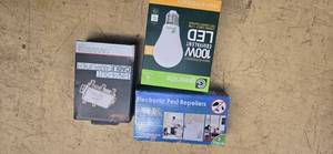 lot 31 image: Lot of a Cable Multiplier, an insect repellent and a 4pk 100W Equivalent LED Light Bulbs