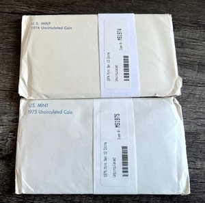 lot 74 image: 1974 & 1975 U.S. Mint Uncirculated Coin Sets - Eisenhower Dollars