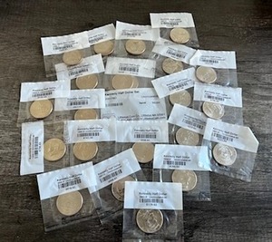 lot 79 image: Huge Lot of 22 Sealed Uncirculated Kennedy Half Dollars (1990s and 2000s)