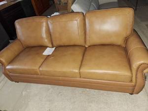 lot 6 image: 80 brown faux leather couch
