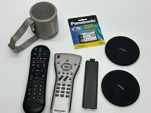 lot 290 image: Sony Portable Speaker with Strap & Anker Wireless Chargers 2-Pack Panasonic Phone Battery Xfinity & Sharp Remotes