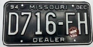 lot 380 image: Missouri Dealer License Plate D716-H 1994 - St Charles MO Sticker