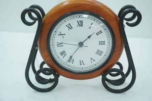 lot 35 image: Mantle Clock. 9 wide by 8 tall