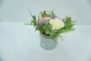 lot 43 image: artificial flower arrangement in galvanized steel planter
