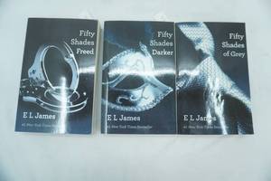 lot 64 image: Fifty Shades Book Set by E.L. James