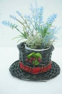 lot 165 image: Frostys Black Wicker Hat Basket and Flower Arrangement
