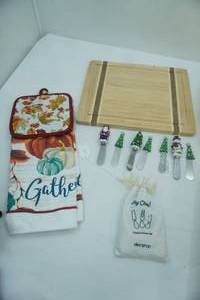 lot 182 image: Cutting Board, Christmas Themed, Cheese Knife Set, Fall Themed Potholder and Towel Set.