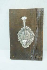 lot 226 image: Ornate Metal Hook on Vintage Wood Board