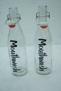 lot 248 image: Vintage-Style Clear Glass Mouthwash Bottles