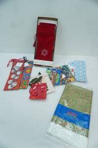 lot 323 image: NEW Christmas Gift Bags, Plastic Tablecloth, Velvety Wine Sleeves