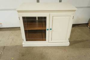 lot 375 image: Painted Pressed Wood Cabinet on wheels wglass door and solid wood removable top. 38x20x31