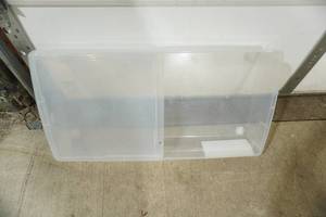 lot 376 image: Large Poly Storage Container on 4 wheels with half a lid. 34x17.5x 6