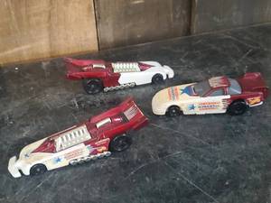 lot 27 image: 3 Beautiful 1990s Hot Wheels Dragsters checkers auto parts and more