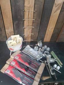 lot 32 image: Mixed lot of household items New Grill Grates Shower Heads, and Antique Meat Grinder