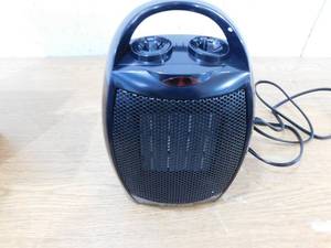 lot 135 image: R.W.FLAME 1,500-Watt Compact Indoor Small Ceramic Electric Heater with Adjustable Thermostat and Carry Handle, Black