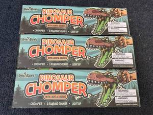 lot 26 image: 3 Dinobros Dinosaur Chompers