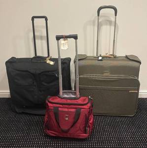 lot 123R image: LL - Tumi, Briggs & Riley & TravelPro Rolling Suitcases  Luggage