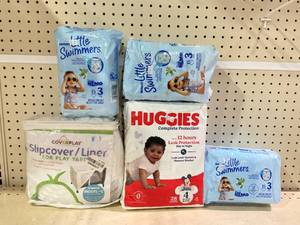 lot 193 image: LOT OF Huggies Little Swimmers Size 3, Huggies Complete Protection Size 4 & Slipcover For Play Yard