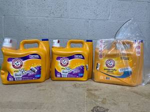lot 354 image: LOT OF 3 Arm & Hammer Laundry Detergents (1 Cap Missing) (2 Bottles Plus OxiClean Odor Blasters 208 fl. oz. & 1 Bottle Powerfully Clean 170 fl. oz.)