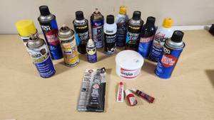 Various Opened and Used Automotive Fluids and Adhesives Including Liquid Wrench Lubricating Oil, PB Blaster Penetrating Catalyst, and Gojo Hand Cleaner