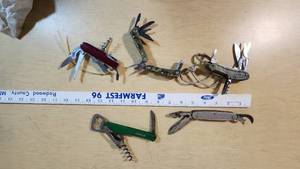 Lot of Multi-Tool Knives including Swiss Army and Heineken Branded Items