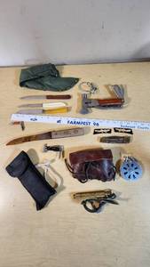Assorted Tools and Camping Gear including Multi-Tool Ax, Knives, and Camping Accessories