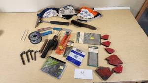 Various Welding Tools and Accessories including Magnetic Holders, Flint Lighter, and Welding Lenses