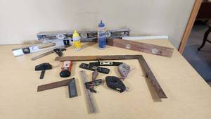 Assorted Hand Tools including Levels, Squares, and Chalk Lines