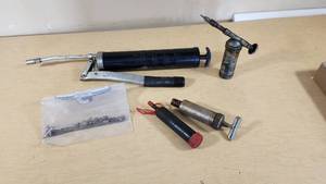 Lot of Hand Tools and Hardware Items including Grease Guns, Hooks, Chains, and Hinges