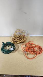 Green, yellow, and orange extension cords
