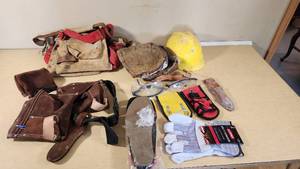 Assorted Construction Safety Gear including Tool Belt, Hard Hat, and Gloves