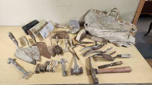 Set of Vintage Masonry Tools including Trowels, Floats, and Hammers