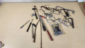 Assorted hand tools including Allen wrenches, magnetic pickup tools, and other accessories
