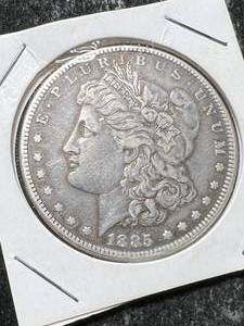 lot 63 image: 1885 US MORGAN SILVER DOLLAR
