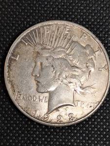 lot 12 image: 1923 Peace Dollar - United States of America One Dollar Silver Coin