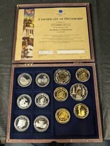 lot 88 image: Symbols of Freedom - 12-Coin Set by American Mint in Wood Display Box
