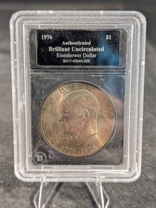 lot 186 image: 1976 Eisenhower Dollar - Brilliant Uncirculated, Authenticated in Slab