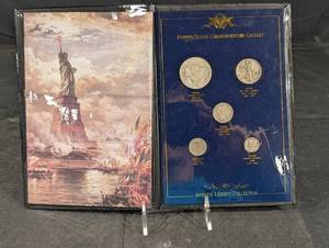 lot 206 image: Antique Liberty Collection United States Commemorative Gallery Coin Set in Blue Display