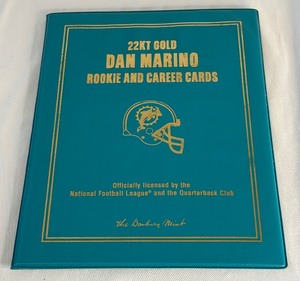 lot 57 image: Dan Marino 22kt Gold Rookie and Career Cards Football Book by Danbury Mint