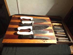 lot 29 image: Vintage cutting board with a pull-out drawer of vintage Chicago Cutlery knives and more