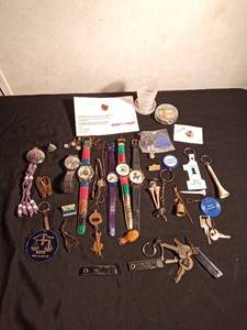 lot 41 image: Vintage watches, advertisement key chains, cuff links, pins vintage souvenir folding cup, noise maker toy and more