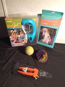 lot 67 image: Pet Jet (to wash your pet), pet car restraint, clippers, toys