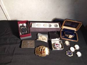 lot 73 image: Mens vintage jewelry watches (1 works and 1 with 23 jewels), 3 belt buckles, pins and tie tack and coin holders- See Details