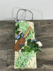 lot 355 image: Wall Hanging Home Decor - Barb Wire for Hook with Garden Spade, Gloves & Artificial Flowers - On a Piece of Wood made to Look Old