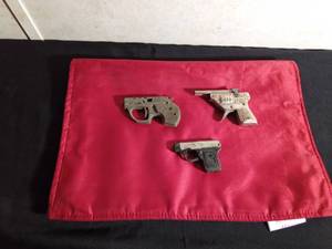 lot 143 image: 1965 metal multi pistol 09 cap gun by Topper Toys, vintage HAWK tin toy cap gun, vintage metal pencil sharpener pistol