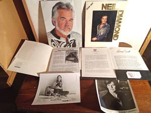 lot 162 image: Kenny Rogers 10th Anniversary picture book, Neil Diamon 1987 tour book, Songwriter Ellis Paul story and1995 photo, Story and 1992 photo of Rodney Crowell
