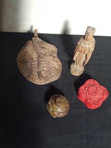 lot 188 image: Chinese hand carved stone snuff bottle, dried branch pod, carved wood statue, and a wood trinket box